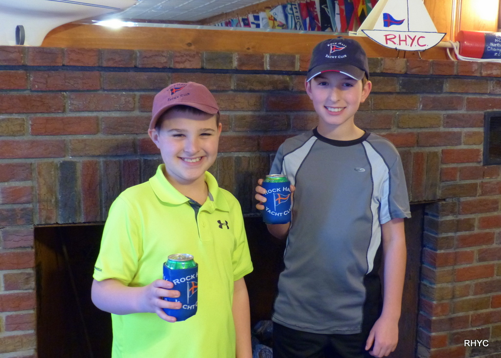 Grady and Cooper wearing hats and drinking cool sodas